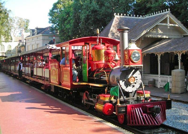 Disneyland Railroad locomotive #3, Ward Kimball, pulling into the New Orleans Square Station.