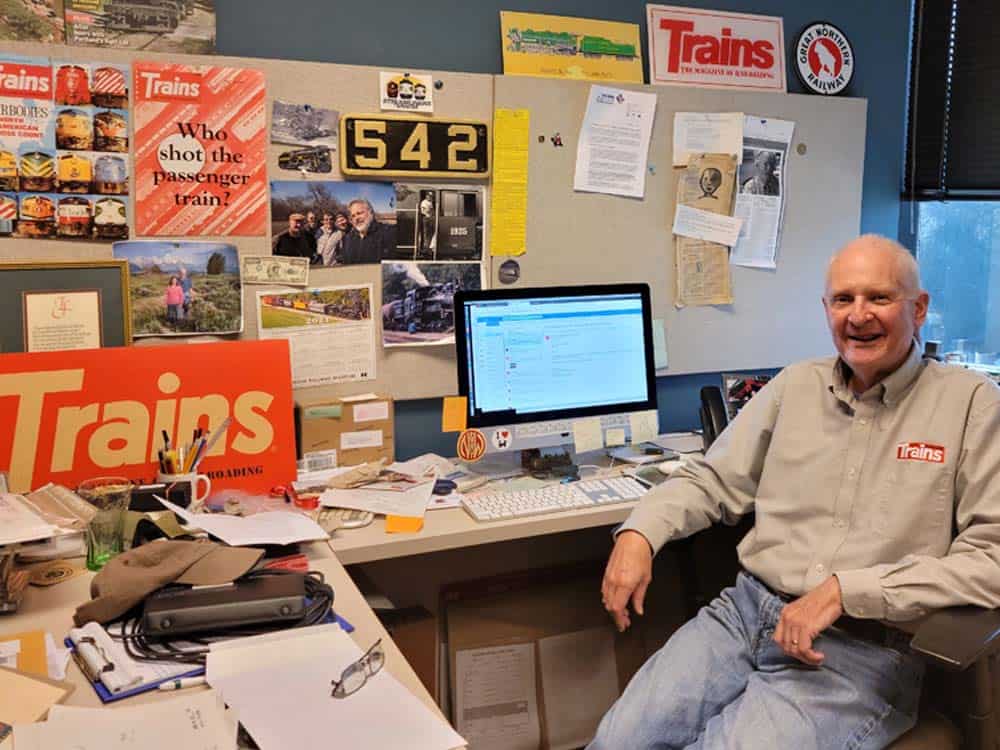 Jim Wrinn at his Kalmbach Media desk as Editor of Trains Magazine.