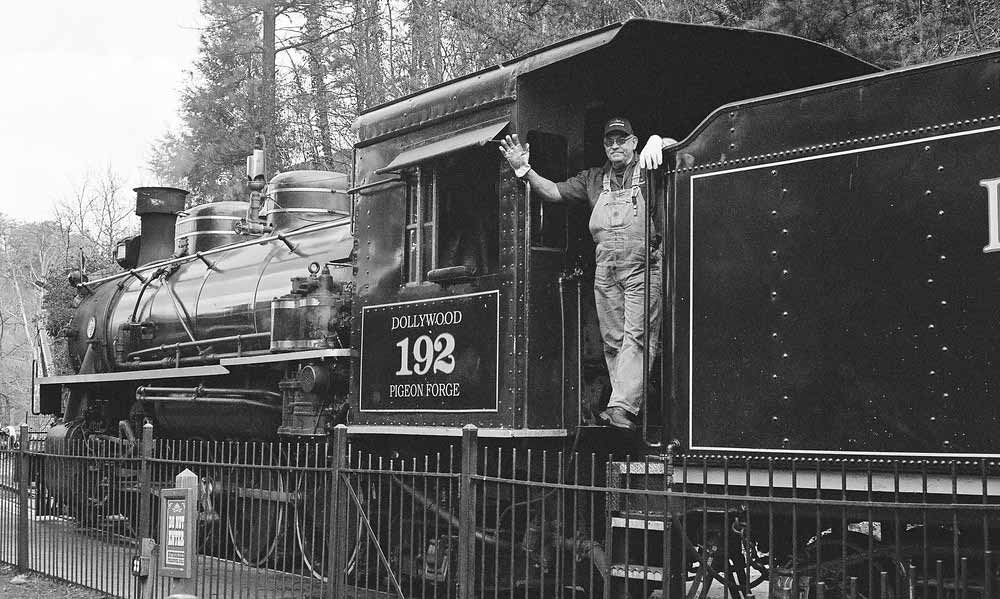 Crewman waves to the crowd from the Dollywood Express Soldier.