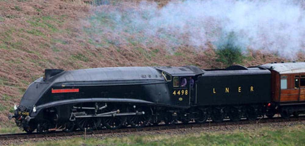 The Sir Nigel Gresley in her World War 2 livery of black on black. The LNER - and other railroads in Britain - ditched their company colors in deference to the dangers of German fighters and bombers flying overhead.