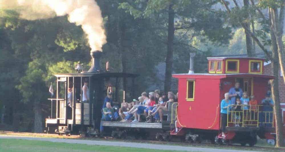 Passengers enjoying a trip behind Keith Mason's Climax steam locomotive on the Locust Heights & Western Railroad. (Photo courtesy of LH&WRR)