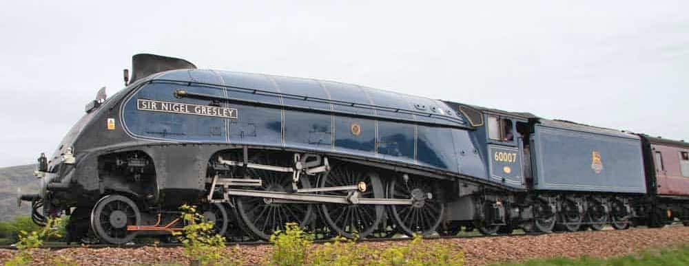 A streamlined Class A4 Pacific steam locomotive, the Sir Nigel Gresley leads an excursion in 2011.