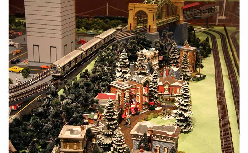 A Lionel train circles a Christmas Village.